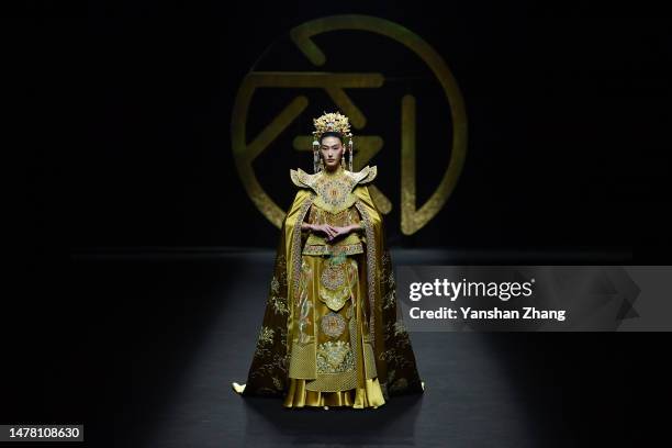 Model walks the runway at LOOLAYY collection show by designer Xiaoqi Zhang during the day 7 of China Fashion Week AW23 at 751 D.Park on March 30,...