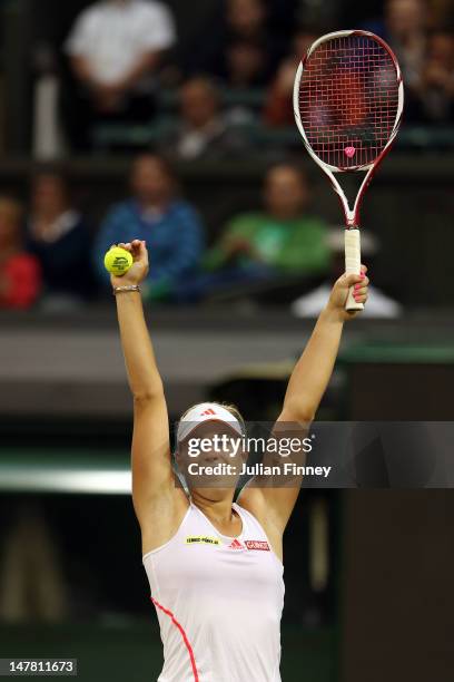 Angelique Kerber of Germany celebrates during her Ladies' Singles quarterfinal match against Sabine Lisicki of Germany on day eight of the Wimbledon...