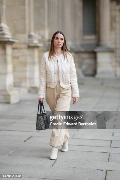 Maria Rosaria Rizzo wears a beige quilted checkered pattern / buttoned jacket from Emme by Marella, beige puffy large pants from Emme by Marella, a...