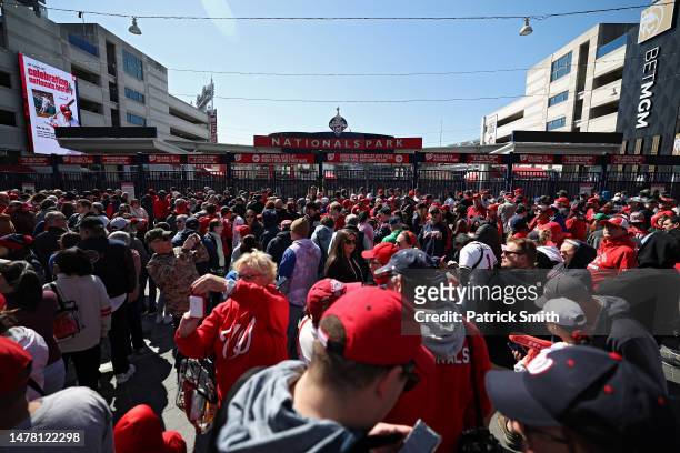 Baseball fans and passerby congregate outside the ballpark before gates open prior to the Atlanta Braves playing against the Washington Nationals on...