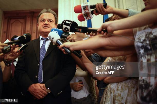 Leader of the Liberal Democrat Party and former Senate speaker, Vasile Blaga, talks to the media, in Bucharest on July 3 shortly before being sacked...