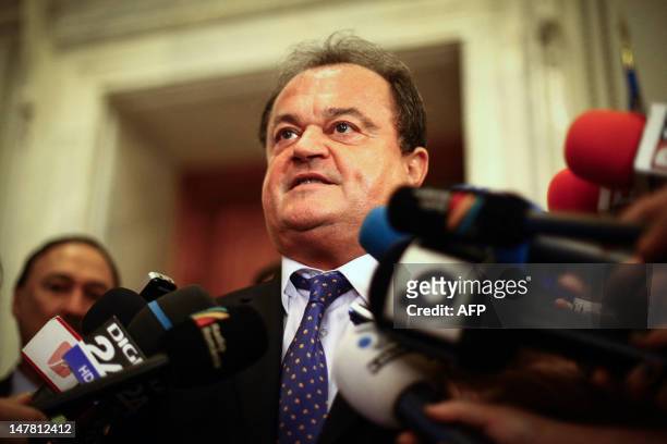Leader of the Liberal Democrat Party and former Senate speaker, Vasile Blaga, talk to the media, in Bucharest on July 3 shortly before being sacked...