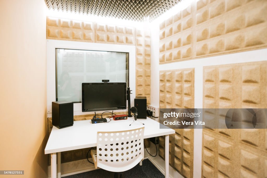 Panoramic view of empty professional soundproofing room and audio recorder space