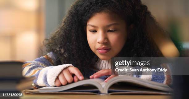 kid reading book for learning, education and language development, literature or story knowledge. biracial girl or child with library books or textbook for creative mind, storytelling and studying - pre adolescent child stock pictures, royalty-free photos & images