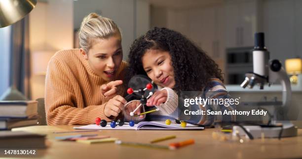 education, mother and girl with homework, science and learning with chemistry, discussion and help. family, mama and daughter with books, studying and project for homeschool, biology and chatting - school project stock pictures, royalty-free photos & images