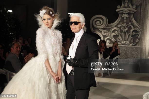 Karl Lagerfeld and wedding dress model walk the runway during the Chanel Haute-Couture Show as part of Paris Fashion Week Fall/Winter 2012/13 at...