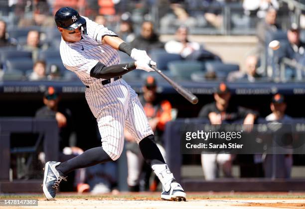 Aaron Judge of the New York Yankees connects for a solo home run during the first inning against the San Francisco Giants on Opening Day at Yankee...
