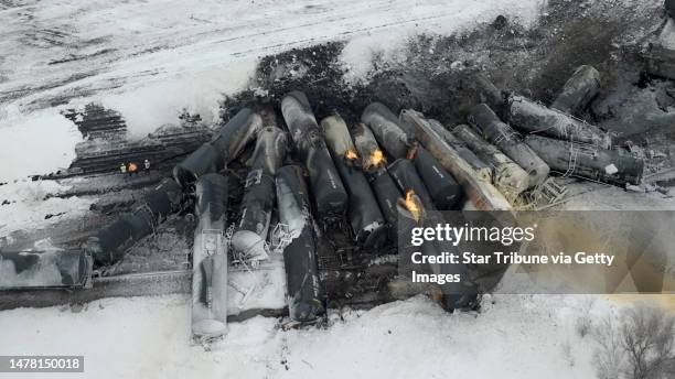 Aerial view of the scene after a BNSF train carrying ethanol and corn syrup derailed and caught fire in the west-central Minnesota town of Raymond...