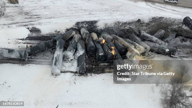 Aerial view of the scene after a BNSF train carrying ethanol and corn syrup derailed and caught fire in the west-central Minnesota town of Raymond...