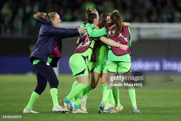 VfL Wolfsburg players celebrate following the UEFA Women's Champions League quarter-final 2nd leg match between VfL Wolfsburg and Paris Saint-Germain...