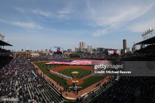 General view of Wrigley Field during the playing of the national anthem prior to the game between the Chicago Cubs and the Milwaukee Brewers on March...