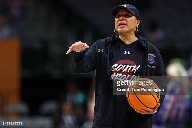 Head coach Dawn Staley of the South Carolina Gamecocks looks on during practice before the 2023 NCAA Women's Final Four semifinal game at American...