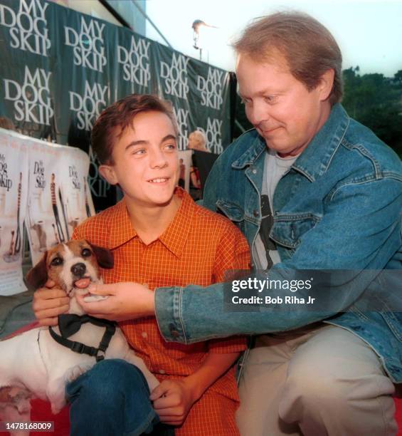 Director Jay Russell , actor Frankie Muniz and celebrity dog Skip on the red carpet for film My Dog Skip, July 11, 2000 in Hollywood section of Los...