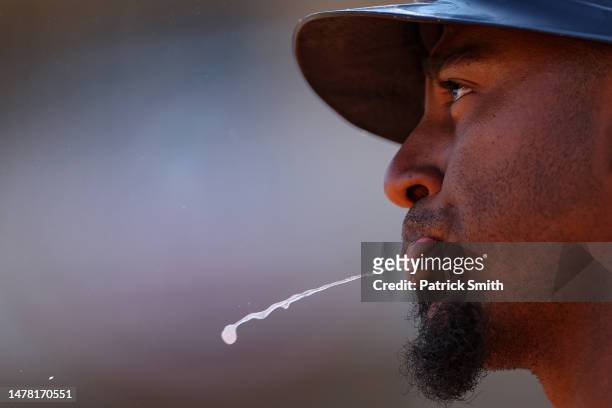 Ozzie Albies of the Atlanta Braves spits before batting against the Washington Nationals during the third inning on Opening Day at Nationals Park on...
