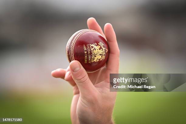 The 'Duke' cricket ball is held during the Derbyshire CCC photocall at The Incora County Ground on March 30, 2023 in Derby, England.