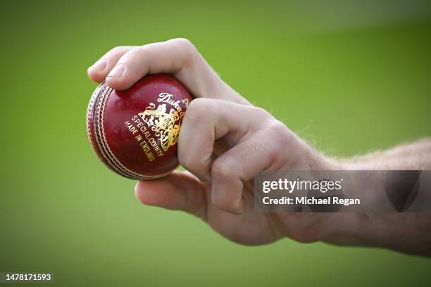 The 'Duke' cricket ball is held during the Derbyshire CCC photocall at The Incora County Ground on March 30, 2023 in Derby, England.