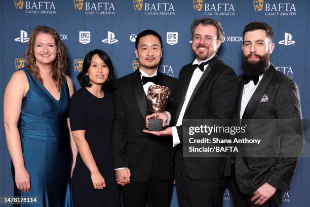 Rebekah Saltsman, Janice Kwan, Terence Lee, Games developer Andrew Shouldice and Kevin Regamey with the Game Design Award for 'Tunic' during the 2023...