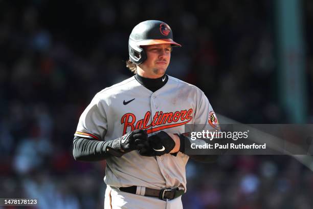 Adley Rutschman of the Baltimore Orioles reacts during the fourth inning against the Boston Red Sox on Opening Day at Fenway Park on March 30, 2023...