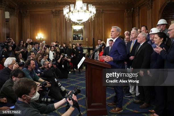 Speaker of the House Rep. Kevin McCarthy speaks to members of the press as other House Republicans listen during a news conference after the vote for...