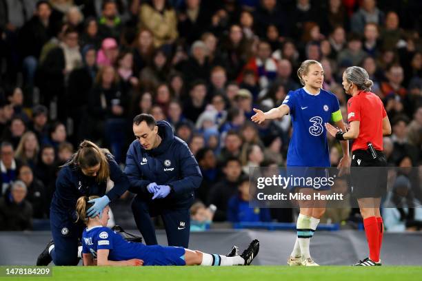 Melanie Leupolz of Chelsea receives medical treatment as Magdalena Eriksson of Chelsea speaks with match referee Ivana Martincic during the UEFA...