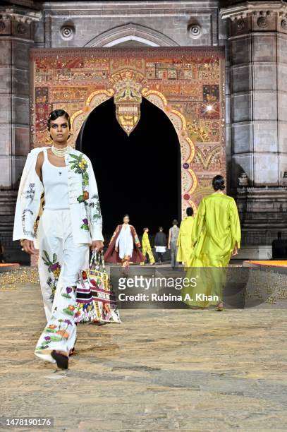 Model walks the runway during the Dior Fall 2023 show at the Gateway of India monument on March 30, 2023 in Mumbai, India.