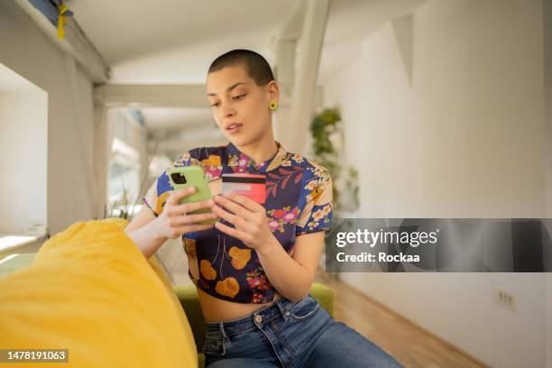happy young customer enjoys shopping online - gen z shopping stock pictures, royalty-free photos & images