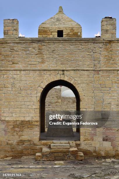 ancient stone arch in the ancient wall of the minaret - stone arch stock pictures, royalty-free photos & images