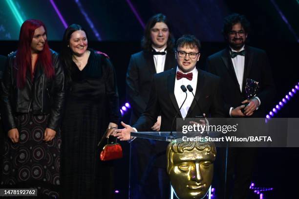 Sam McGarry, from poncle studio, accepts the Best Game Award for 'Vampire Survivors' onstage during the 2023 BAFTA Games Awards at the Queen...