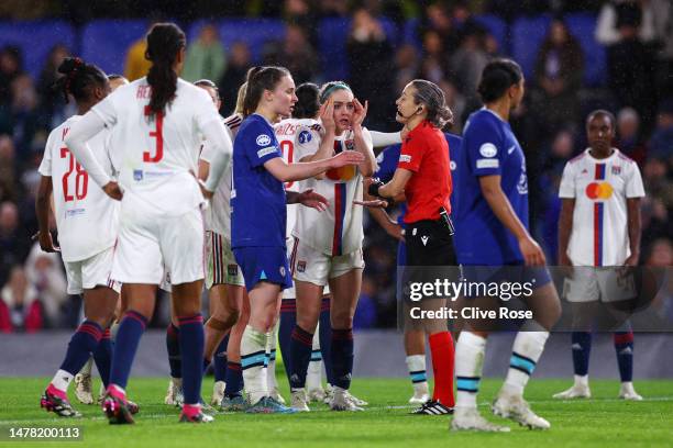 Match Referee, Ivana Martincic speaks with players of both teams during the UEFA Women's Champions League quarter-final 2nd leg match between Chelsea...