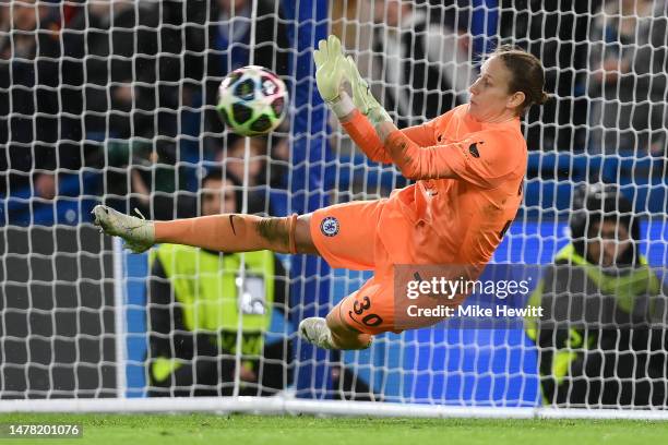 Ann-Katrin Berger of Chelsea makes a save from Wendie Renard of Olympique Lyonnais for Olympique Lyonnais' third penalty in the shootout during the...