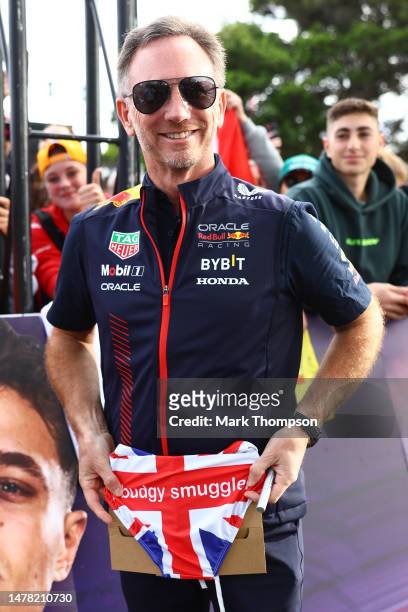 Red Bull Racing Team Principal Christian Horner is gifted a pair of Union Jack budgy smugglers as he greets fans on the Melbourne Walk prior to...