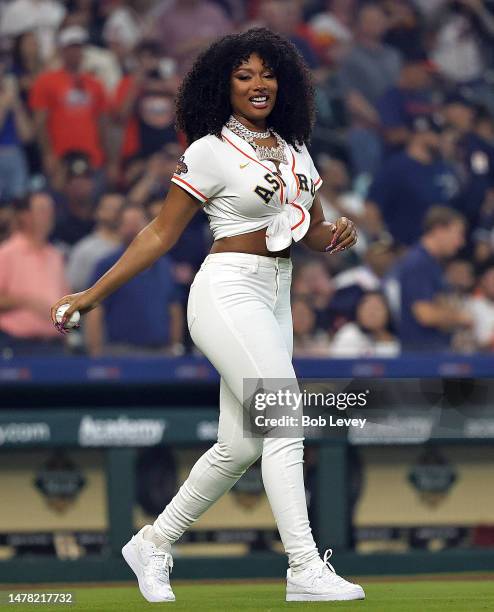 Megan Thee Stallion throws out the first pitch as the Houston Astros play the Chicago White Sox on Opening Day at Minute Maid Park on March 30, 2023...