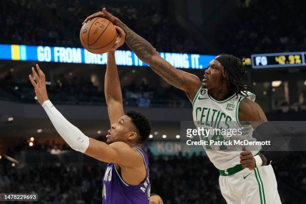 Robert Williams III of the Boston Celtics blocks a shot by Giannis Antetokounmpo of the Milwaukee Bucks in the first half at Fiserv Forum on March...