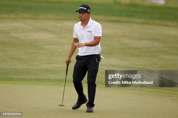 Satoshi Kodaira of Japan reacts after making par on the seventh green during the first round of the Valero Texas Open at TPC San Antonio on March 30,...