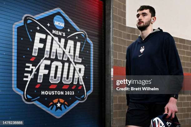 Alex Karaban of the Connecticut Huskies walks during media availability for the Final Four as part of the NCAA Men's Basketball Tournament at NRG...