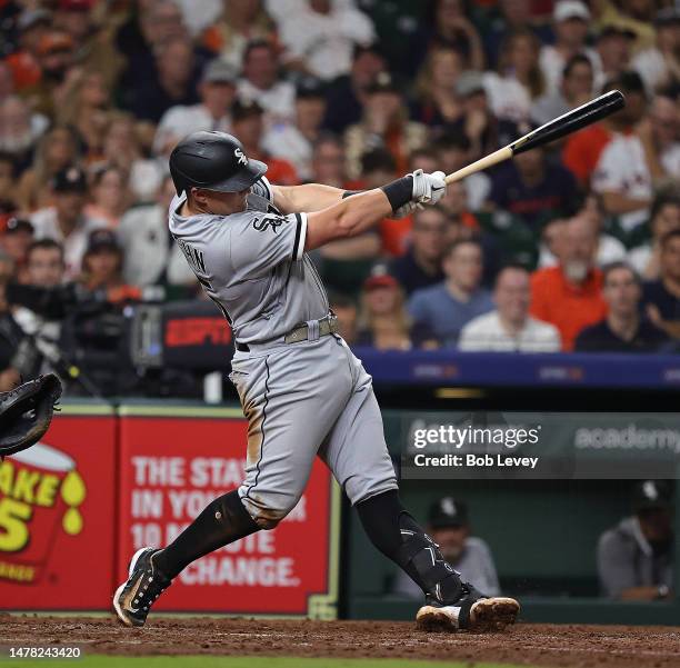 Andrew Vaughn of the Chicago White Sox doubles in two runs in the ninth inning against the Houston Astros on Opening Day at Minute Maid Park on March...