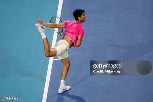 Carlos Alcaraz of Spain serves against Taylor Fritz of the United States in the quarter-finals of the men's singles at the Miami Open at the Hard...