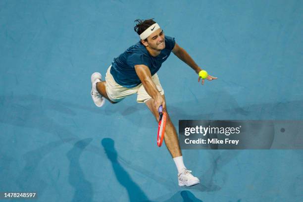 Taylor Fritz of the United States hits a forehand against Carlos Alcaraz of Spain in the quarter-finals of the men's singles at the Miami Open at the...