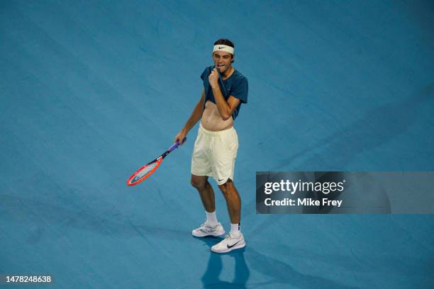 Taylor Fritz of the United States looks frustrated during his match against Carlos Alcaraz of Spain in the quarter-finals of the men's singles at the...