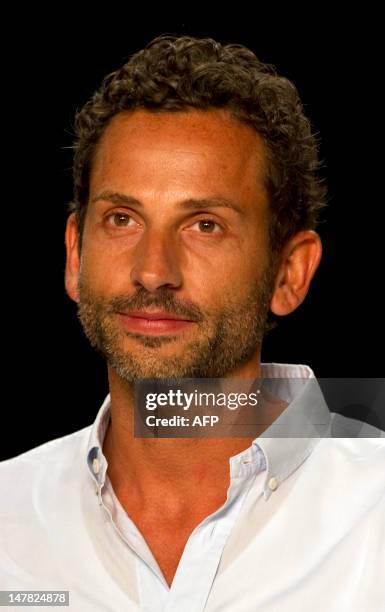 Dimitri Panagiotopoulos, designer of the Italian fashion label Dimitri, poses during the Spring/Summer 2013 shows of the Mercedes-Benz Fashion Week...