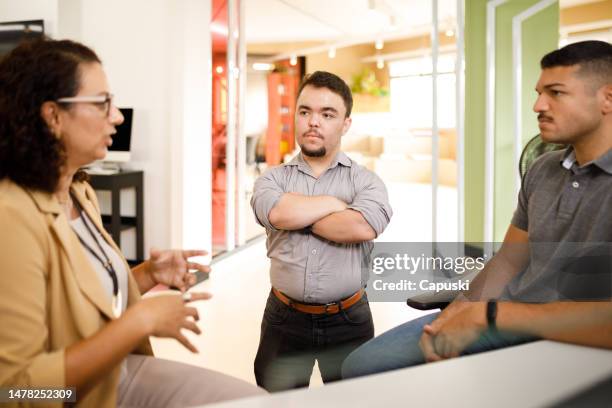 focused people during a small meeting at the office - dwarf stock pictures, royalty-free photos & images