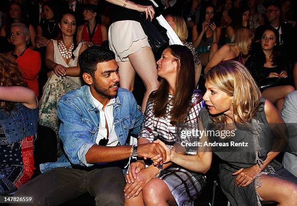 Noah Becker, Dana Schweiger and Ursula Karven sit in front row during the Designer For Tomorrow show at the Mercedes-Benz Fashion Week Spring/Summer...