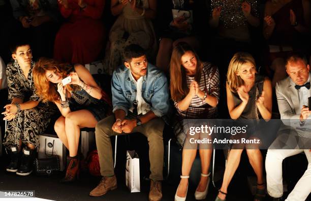 Alina Sueggeler, Palina Rojinski, Noah Becker, Dana Schweiger and Ursula Karven sit in front row during the Designer For Tomorrow show at the...