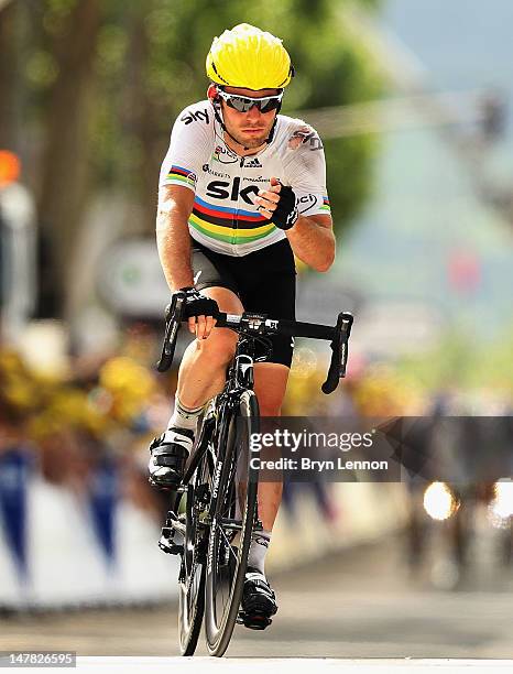 World Road Race Champion Mark Cavendish of Great Britain and SKY Procycling crosses the finishline after crashing near the end of stage four of the...