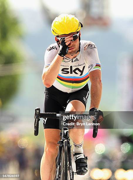 World Road Race Champion Mark Cavendish of Great Britain and SKY Procycling crosses the finishline after crashing near the end of stage four of the...