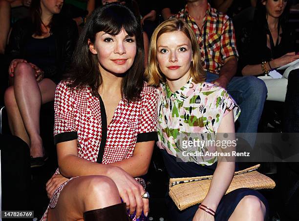 Nadine Warmuth and Karoline Schuch sit in front row during the Designer For Tomorrow show at the Mercedes-Benz Fashion Week Spring/Summer 2013 on...