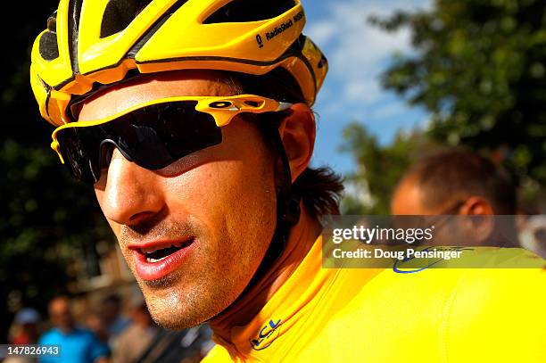 Fabian Cancellara of Switzerland riding for Radioshack-Nissan in the race leader's yellow jersey prepares for the start of stage four of the 2012...