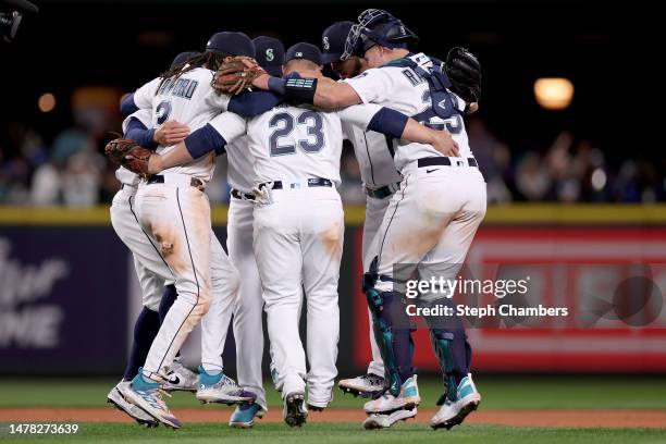 The Seattle Mariners celebrate their 3-0 win against the Cleveland Guardians during Opening Day at T-Mobile Park on March 30, 2023 in Seattle,...