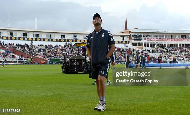 Jonathan Trott of England looks to the skies as rain delays the start of the 3rd Natwest One Day International match between England and Australia at...