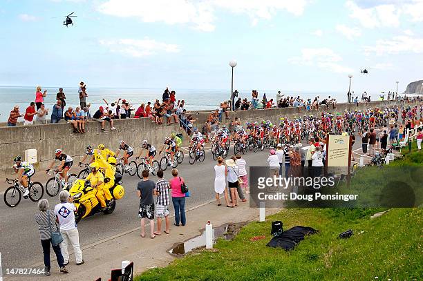The peloton passes the seaside during stage four of the 2012 Tour de France from Abbeville to Rouen on July 4, 2012 in Ste Marguerite sur Mer, France.